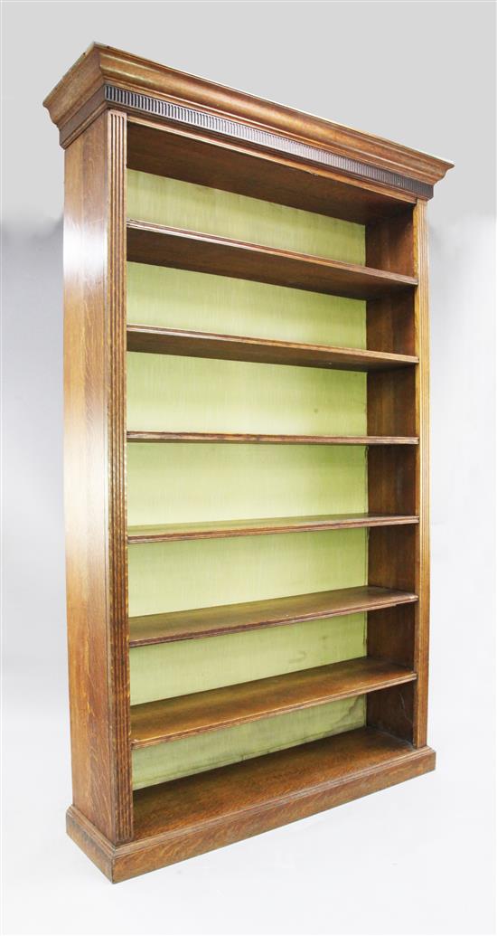 A large oak open bookcase, H.8ft 1in. W.4ft 9in. D.1ft 4in.